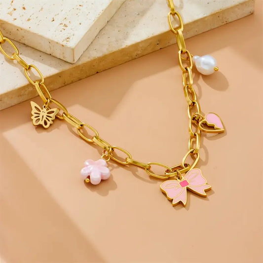 Golden Grace: Bow Pendant Necklace with Heart and Flower Charms