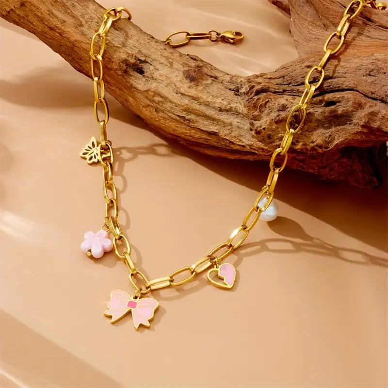 Golden Grace: Bow Pendant Necklace with Heart and Flower Charms