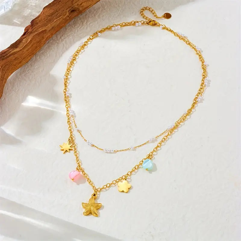Coastal Elegance: Starfish, Star, and Flower Pendant Necklace