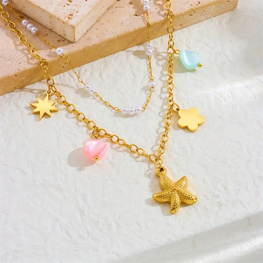 Coastal Elegance: Starfish, Star, and Flower Pendant Necklace